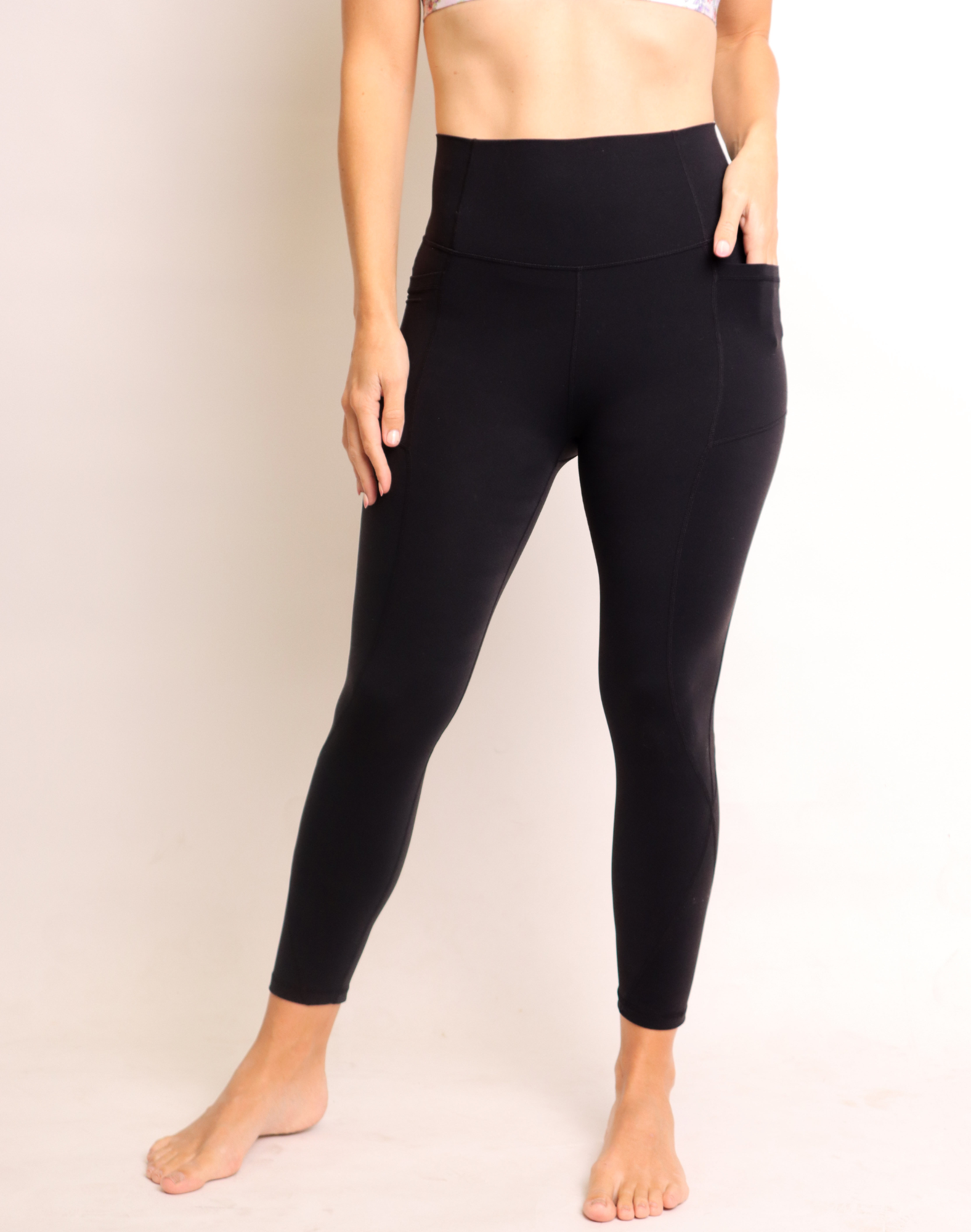 back view of high waisted post pregnancy support leggings in black
