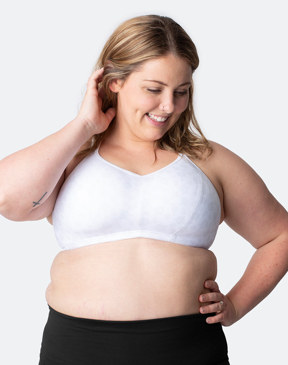 happy mum wearing lightly padded sports bra